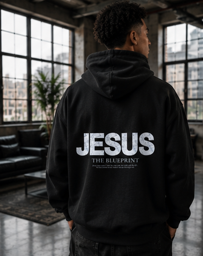 Person wearing a black hoodie with 'JESUS' printed on the back in various indoor settings.