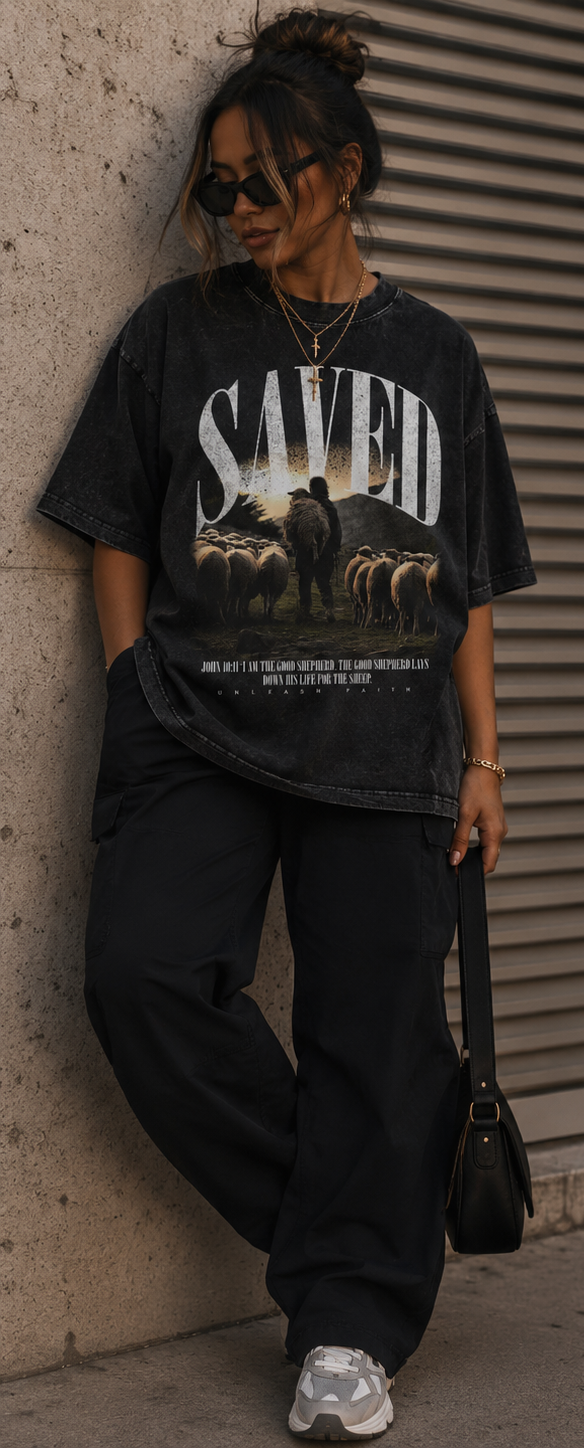 Person wearing a black 'SAVED' graphic t-shirt with a bear design, shown from front, back, and side views.